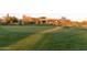 Scenic view of green golf course with desert landscaping and luxurious homes at 10795 E Sutherland Way, Scottsdale, AZ 85262