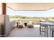 Inviting outdoor patio with seating, offering scenic views of the mountains and desert landscape at 10795 E Sutherland Way, Scottsdale, AZ 85262