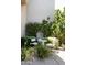 Tranquil outdoor seating area featuring a round table, chairs, and lush garden with climbing plants at 10795 E Sutherland Way, Scottsdale, AZ 85262