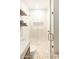 Modern bathroom with glass-enclosed shower and decorative tile floor at 10795 E Sutherland Way, Scottsdale, AZ 85262