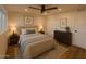 Comfortable bedroom with neutral tones, ceiling fan, closet, and coordinated decor for a relaxing retreat at 1308 N 71St St, Scottsdale, AZ 85257