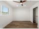 Cozy bedroom with a ceiling fan, wood flooring and a closet at 1308 N 71St St, Scottsdale, AZ 85257