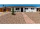 Charming single-story home featuring a walkway, desert landscaping and attached carport at 1308 N 71St St, Scottsdale, AZ 85257