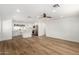 Spacious area featuring wood flooring and an open kitchen with stainless steel appliances at 1308 N 71St St, Scottsdale, AZ 85257