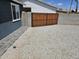This side yard boasts low maintenance rock landscaping and a secure wooden gate at 13629 N 36Th St, Phoenix, AZ 85032