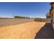 Spacious backyard featuring a block wall, providing privacy and security to the property at 15626 W Georgia Dr, Surprise, AZ 85379