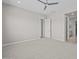 Spacious bedroom featuring soft carpet, a ceiling fan, and a walk-in closet at 15626 W Georgia Dr, Surprise, AZ 85379