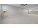 Expansive bonus room with plush carpeting, bright natural light, and versatile layout at 15626 W Georgia Dr, Surprise, AZ 85379