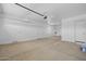 Spacious garage with an automatic door opener and ample room for storage at 15626 W Georgia Dr, Surprise, AZ 85379