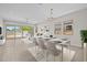 Bright, open-concept living and dining area with tile floors and access to the backyard through sliding glass doors at 15626 W Georgia Dr, Surprise, AZ 85379