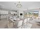 Spacious open-concept design seamlessly connects the kitchen, dining, and living areas with backyard access at 15626 W Georgia Dr, Surprise, AZ 85379