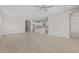 Spacious living room featuring wood-look tile flooring, abundant natural light, and an open floor plan at 15626 W Georgia Dr, Surprise, AZ 85379
