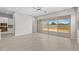 Bright living room with tile floors and sliding glass doors to the backyard at 15626 W Georgia Dr, Surprise, AZ 85379