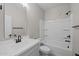 Clean bathroom with a modern vanity, toilet, and shower-tub combination at 15784 W Georgia W Dr, Surprise, AZ 85379