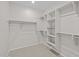 Spacious walk-in closet with shelves and hanging rods for organized storage at 15784 W Georgia W Dr, Surprise, AZ 85379