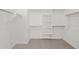 Spacious walk-in closet with ample shelving and hanging space at 15796 W Georgia W Dr, Surprise, AZ 85379