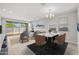 Open floor plan with bright living and dining areas and sliding glass doors to the backyard at 15796 W Georgia W Dr, Surprise, AZ 85379