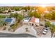 Aerial view of property showcasing a pool, desert landscaping, solar panels and mountain views at 16436 N 64Th Pl, Scottsdale, AZ 85254