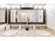 Bathroom featuring double sinks with granite countertops and framed mirror at 16436 N 64Th Pl, Scottsdale, AZ 85254