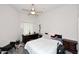Simple bedroom with ceiling fan, carpet, and a desk area at 16705 E Almont Dr # A, Fountain Hills, AZ 85268