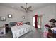 Bedroom with ceiling fan, carpet, and a sliding glass door to the backyard at 16705 E Almont Dr # A, Fountain Hills, AZ 85268
