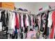 Walk-in closet with built-in storage and organization system for clothing and accessories at 16705 E Almont Dr # A, Fountain Hills, AZ 85268