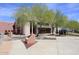 Exterior view of the community center, set among trees, sculptures, and pathways at 16705 E Almont Dr # A, Fountain Hills, AZ 85268
