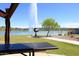 Beautiful lakefront view with a scenic fountain and modern art sculpture in the community at 16705 E Almont Dr # A, Fountain Hills, AZ 85268