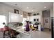 Bright kitchen with white cabinets, quartz countertops, stainless appliances and an island at 16705 E Almont Dr # A, Fountain Hills, AZ 85268