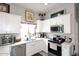 Bright kitchen with white cabinetry, stainless steel appliances, and double basin sink at 16705 E Almont Dr # A, Fountain Hills, AZ 85268
