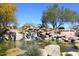 Picturesque Fountain Hills community pond with waterfall, rocks, and lush greenery at 16705 E Almont Dr # A, Fountain Hills, AZ 85268