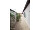 Side yard of a house with gravel landscaping and some plants at 16705 E Almont Dr # A, Fountain Hills, AZ 85268