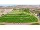 An aerial view of the golf course and surrounding mountain range at 21166 W Main St, Buckeye, AZ 85396