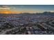 Sunset aerial view showcases a well-planned community near scenic mountains at 21166 W Main St, Buckeye, AZ 85396