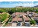 Beautiful aerial view of homes with solar panels, garages, and a mountain backdrop at 21166 W Main St, Buckeye, AZ 85396