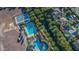 Enjoy this aerial view of the community pools, tennis courts, and well-maintained desert landscaping at 21166 W Main St, Buckeye, AZ 85396