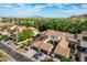 Aerial view featuring homes with tile roofs and garages, set against a backdrop of scenic mountains at 21166 W Main St, Buckeye, AZ 85396