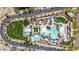 Overhead view of neighborhood amenities includes a resort-style pool, shaded seating, manicured green spaces and mature landscaping at 21166 W Main St, Buckeye, AZ 85396