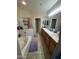 Bright bathroom featuring double vanity, bath tub, and separate glass shower enclosure at 21166 W Main St, Buckeye, AZ 85396