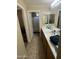 This bathroom boasts a double sink vanity and a separate toilet and shower area at 21166 W Main St, Buckeye, AZ 85396