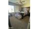 Bedroom featuring a large bed frame and natural light at 21166 W Main St, Buckeye, AZ 85396