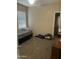 Cozy bedroom with neutral tones and natural lighting at 21166 W Main St, Buckeye, AZ 85396