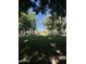 Scenic community park with mature trees and manicured lawns, providing a tranquil and inviting outdoor space for residents at 21166 W Main St, Buckeye, AZ 85396