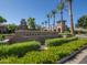 Entrance sign for the Verrado Golf Club with lush landscaping and palm trees at 21166 W Main St, Buckeye, AZ 85396
