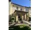 Charming two-story townhouse with a covered porch and well-maintained landscaping at 21166 W Main St, Buckeye, AZ 85396