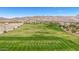 Aerial view of the manicured golf course showing sand traps and desert landscaping at 21166 W Main St, Buckeye, AZ 85396