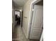 Hallway with access to a bedroom and a closet at 21166 W Main St, Buckeye, AZ 85396