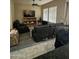 Inviting living room with comfortable seating, a TV and a ceiling fan, perfect for relaxation and entertaining guests at 21166 W Main St, Buckeye, AZ 85396