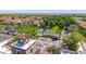 Aerial view of neighborhood featuring fountain, mature trees and lush green spaces at 21166 W Main St, Buckeye, AZ 85396