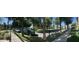 Beautiful street view highlighting the lush green lawns and mature trees shading the sidewalks at 21166 W Main St, Buckeye, AZ 85396